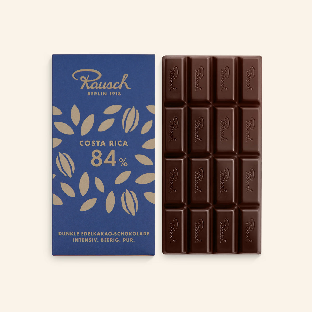 Dunkle Schokolade 84% in rechteckiger Tafel mit Prägung und dunkelblauer Verpackung mit goldenen Blättern. - Rausch