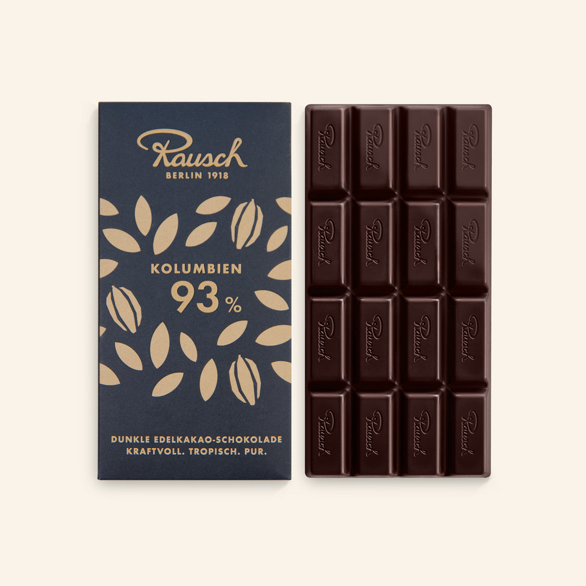 Dunkle handwerkliche Schokolade 93% Kakao neben dunkelblauer Verpackung mit Goldprägung. - Rausch