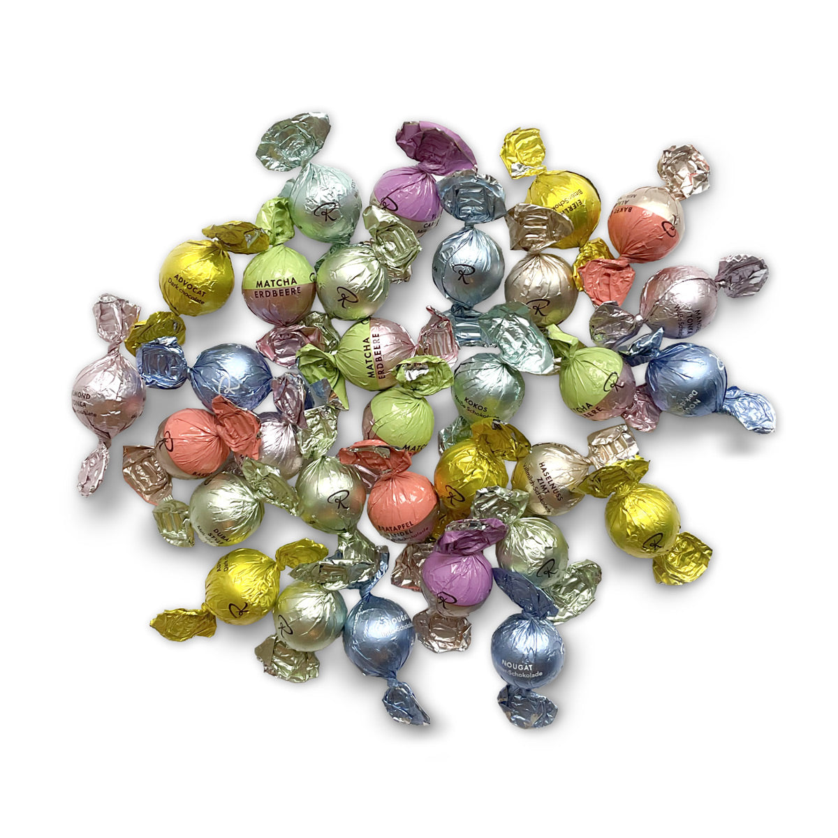Bunte handwerkliche Schokoladenpralinenkugeln in glitzernden Metallic-Folien, rund und klein. - Rausch