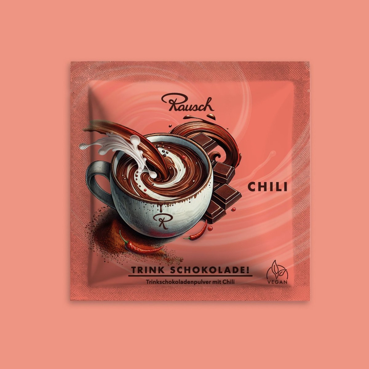 Trinkschokolade "Chili" im roten Sachet auf farblich passendem Hintergrund.