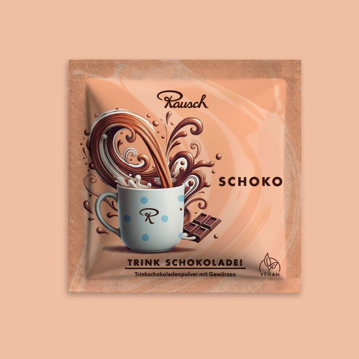Trinkschokolade "Schoko" im lachsfarbenen Sachet auf farblich passendem Hintergrund.