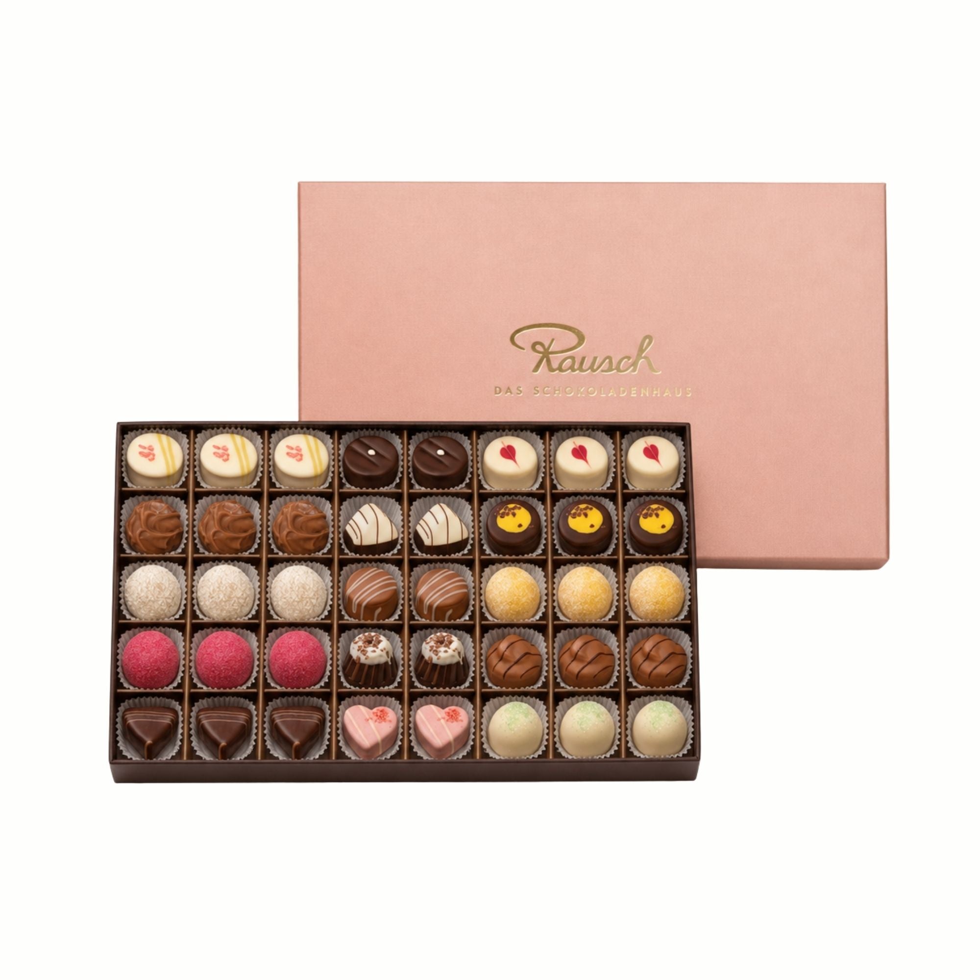 Rosa Schachtel mit 40 handwerklichen Pralinen in verschiedenen Formen und Farben. - Rausch