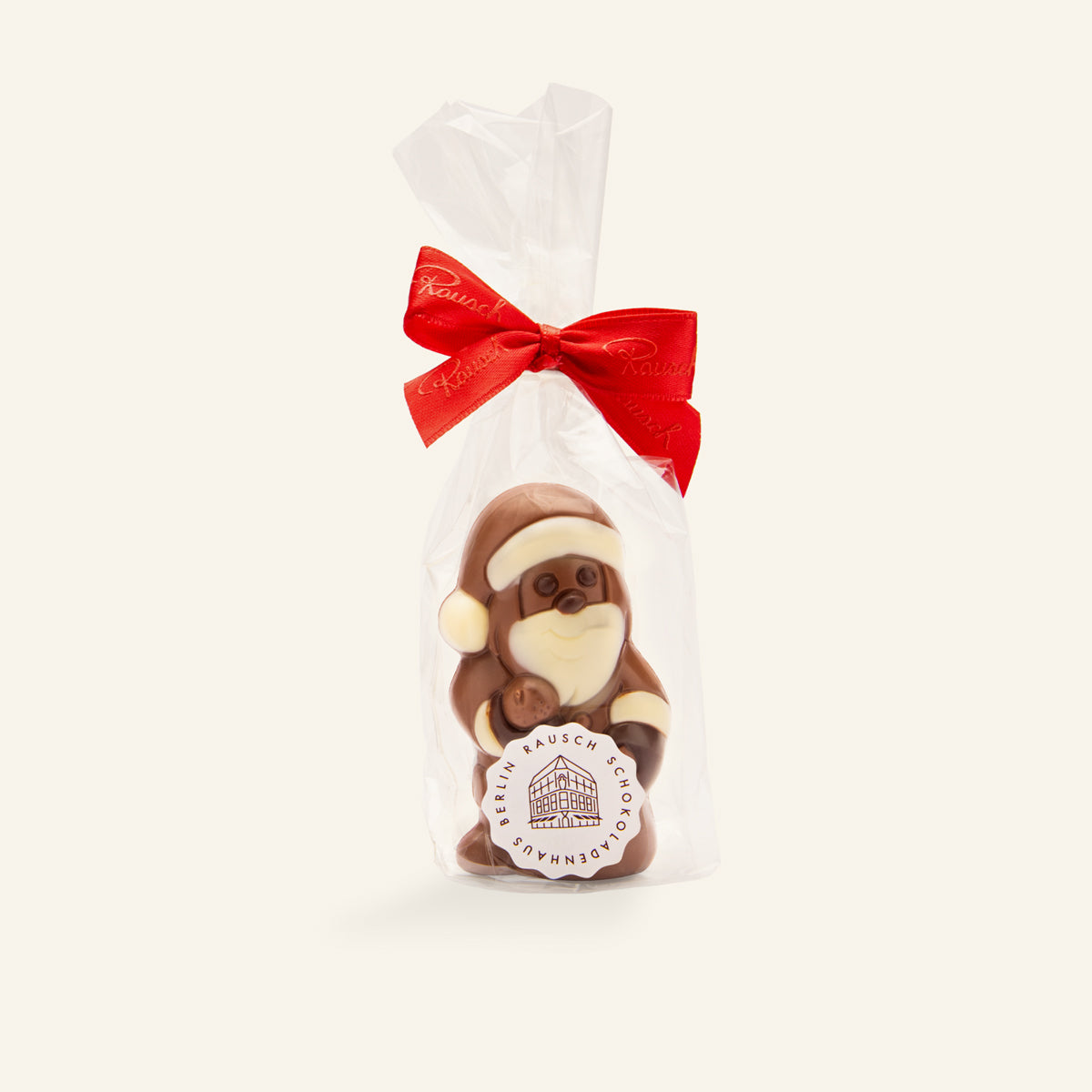 Handgefertigte Schokoladenfigur Weihnachtsmann in braun und weiß, verpackt mit roter Schleife. - Rausch