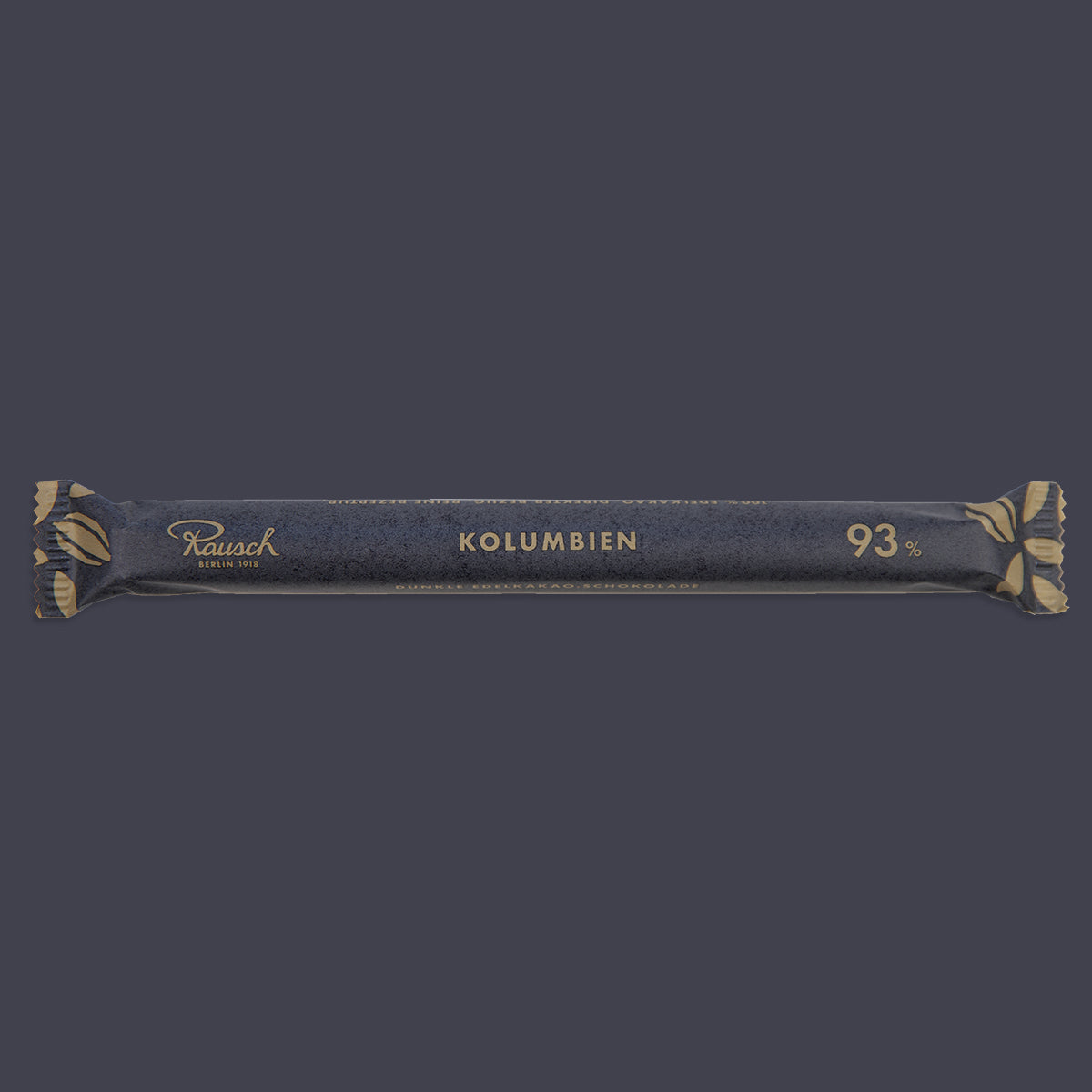 Schmale dunkle Schokoladentafel mit goldenen Ornamenten, Aufschrift „Kolumbien 93 %“. - Rausch